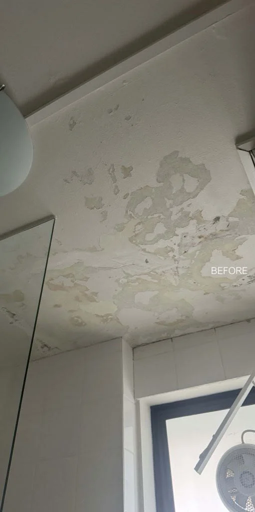 Bathroom ceiling with badly flaking and peeling paint before repair