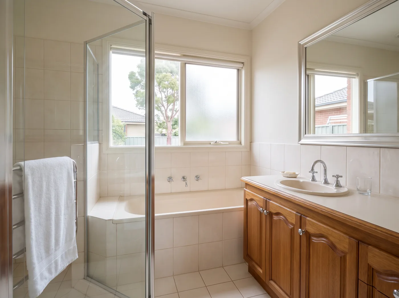 Melbourne bathroom after a detailed clean, with clear shower glass and polished tapware